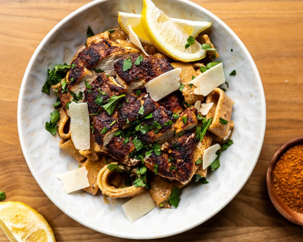 sliced chicken and pasta in bowl