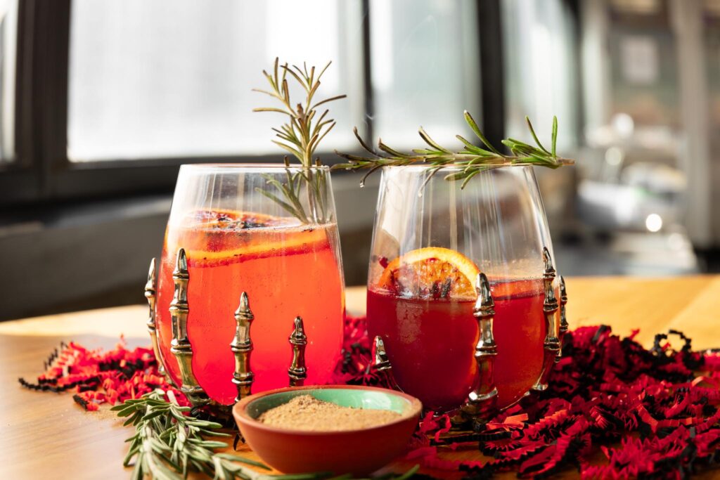 Two cocktail glasses on a wooden table