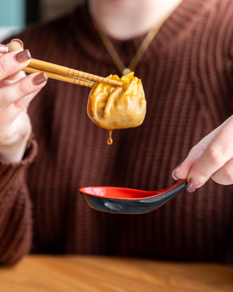 soup dumpling and chopsticks