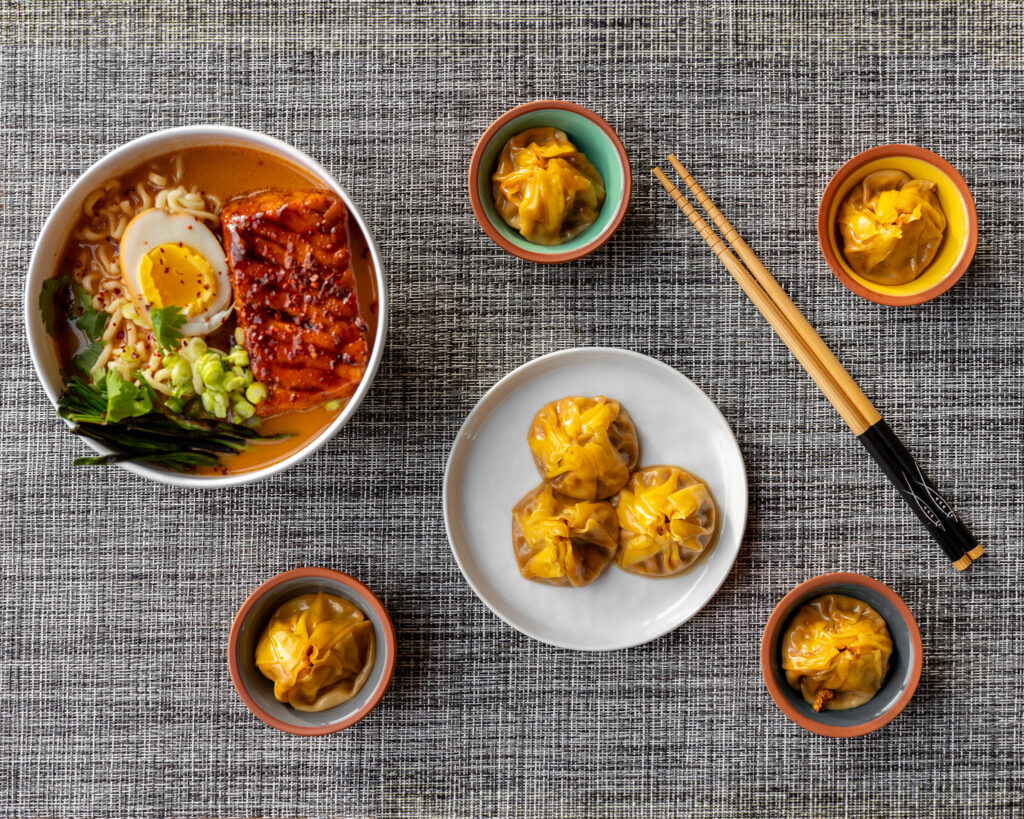 placemat with dumplings and ramen