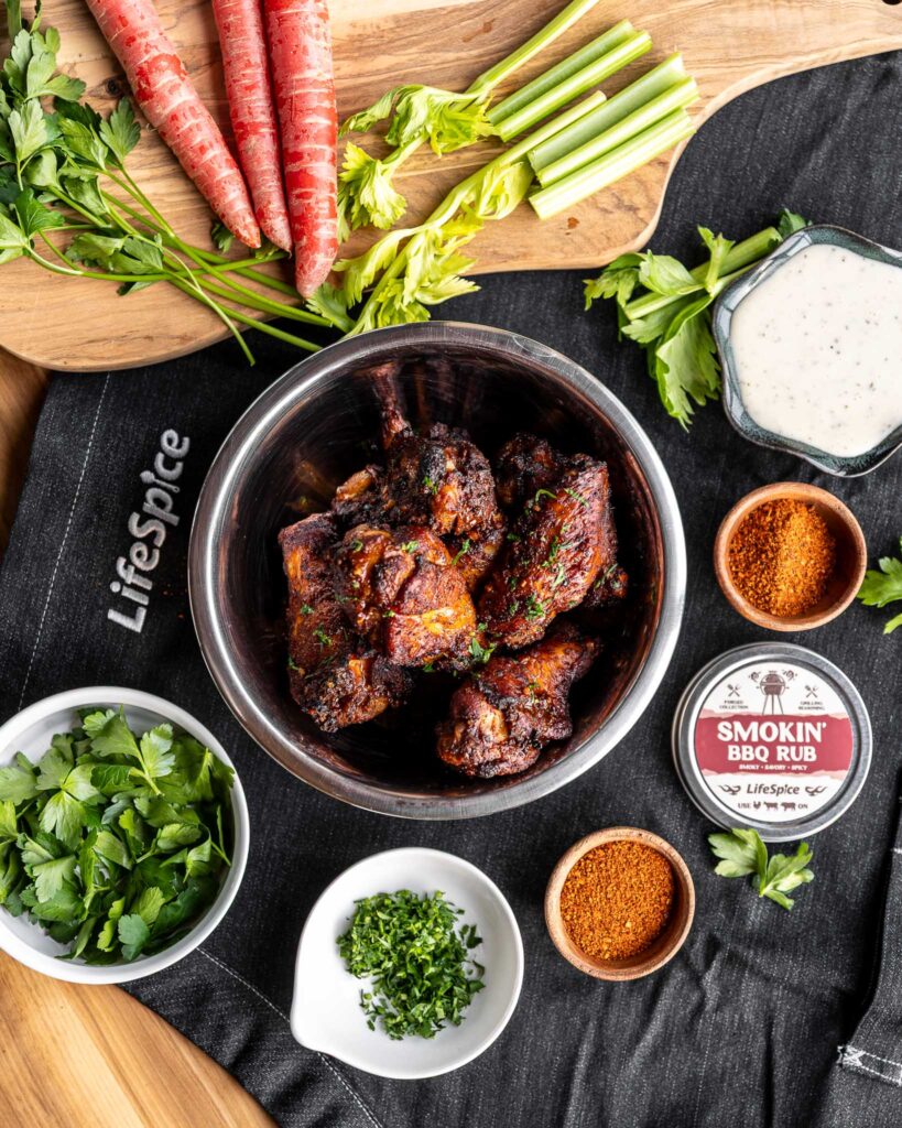 bbq wings in a bowl with seasonings