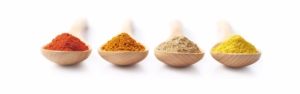 Spice Powders on Wooden Spoons